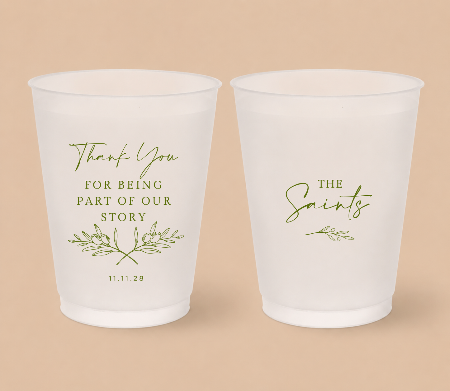 White frosted wedding cups featuring olive branch artwork, The Saints family surname, thank you message, and wedding date for a Mediterranean inspired wedding.