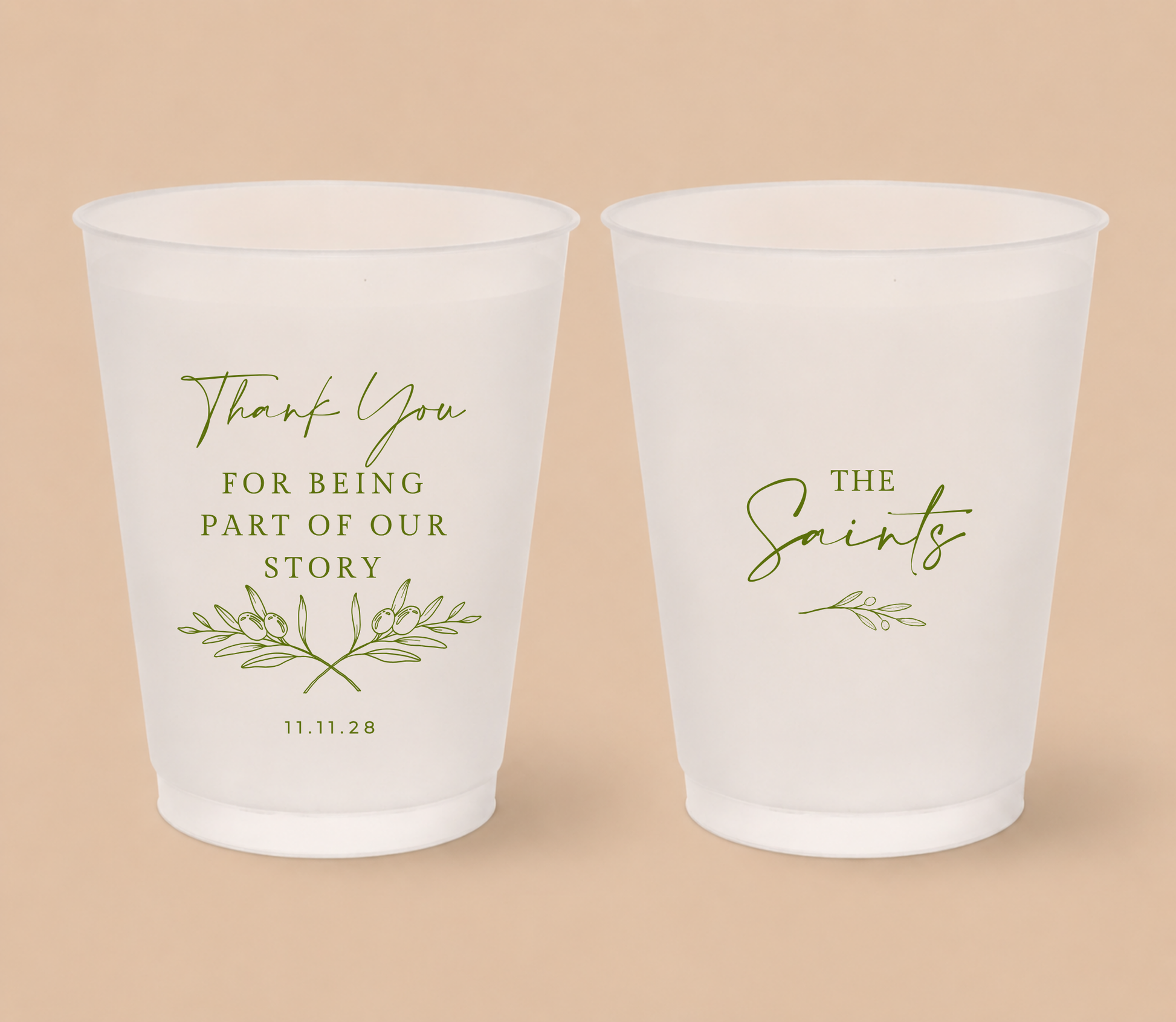 White frosted wedding cups featuring olive branch artwork, The Saints family surname, thank you message, and wedding date for a Mediterranean inspired wedding.