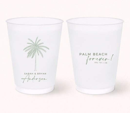 Two personalized frosted wedding cups featuring a minimalist palm tree illustration with Sarah & Bryan Anderson on one side and the phrase "Palm Beach Forever!" with the wedding date 05.10.28 on the reverse.
Personalized Palm Beach wedding cup featuring a minimalist palm tree illustration and custom names.
Reusable frosted wedding cup with tropical palm artwork and personalized destination wedding details.