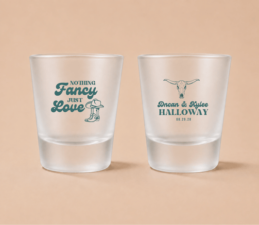 Rustic western wedding shot glass personalized with couple names.

