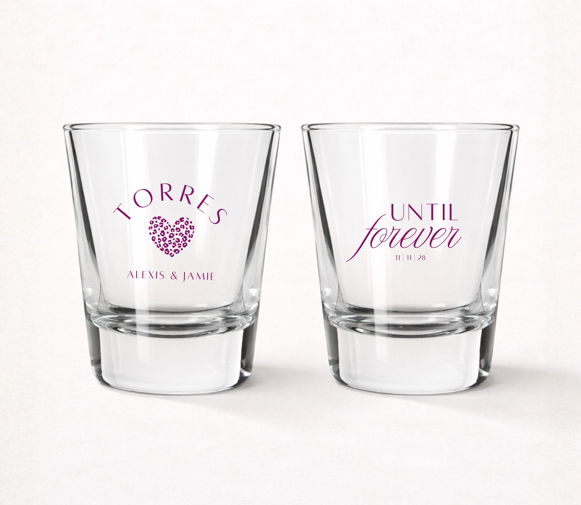 Personalized Until Forever wedding shot glasses featuring custom family name, couple names, wedding date, and modern heart design.