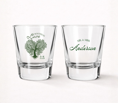 Personalized Rooted in Love wedding shot glasses featuring a custom family name, couple initials, wedding date, and elegant tree illustration.