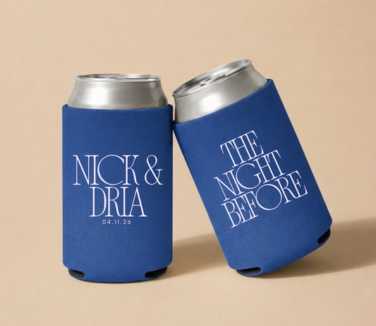 Royal blue personalized foam wedding can coolers featuring custom names Nick and Dria, wedding date April 11, 2026, and modern "The Night Before" typography.
