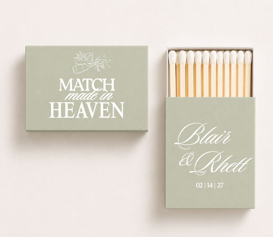 Sage green Match Made in Heaven wedding matchboxes featuring elegant cupid artwork, romantic typography, personalized couple names, wedding date, and premium safety matches.
Match Made in Heaven wedding matchbox featuring cupid artwork and elegant romantic typography.
Personalized wedding matchbox with Match Made in Heaven design, couple names, and wedding date.