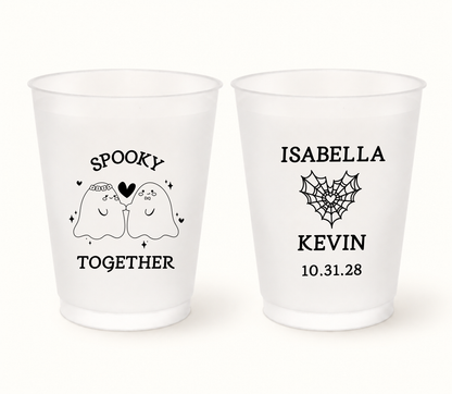 Personalized Spooky Together Halloween wedding frosted cups featuring cute ghost bride and groom artwork, custom couple names, wedding date, and spiderweb heart design.