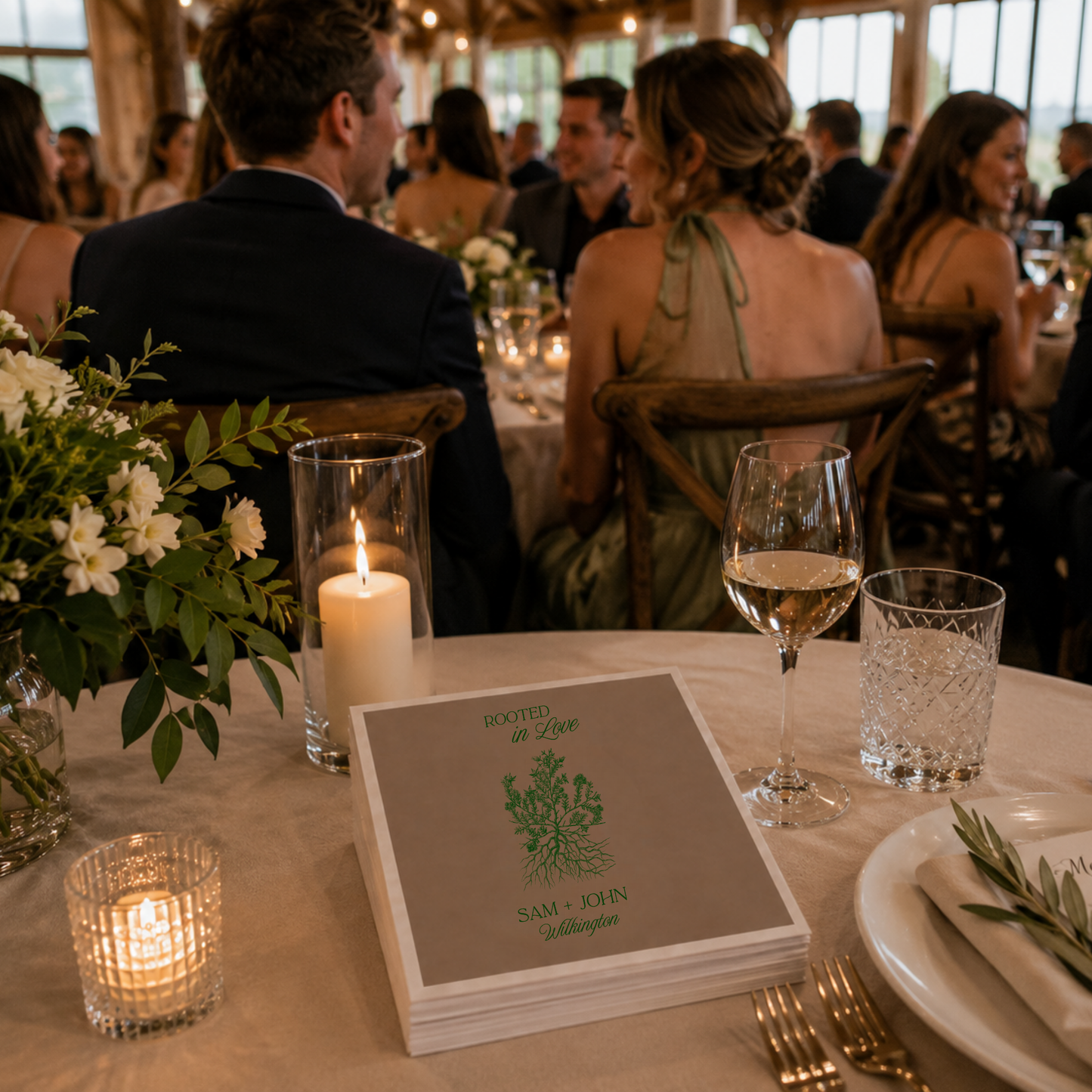 Taupe botanical wedding napkin featuring Rooted in Love artwork and personalized names.