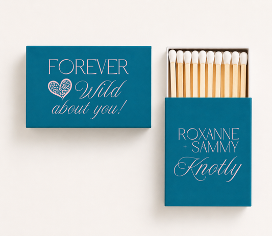 Personalized teal wedding matchboxes featuring soft pink Forever Wild About You lettering, leopard print heart, and Roxanne and Sammy custom couple names.