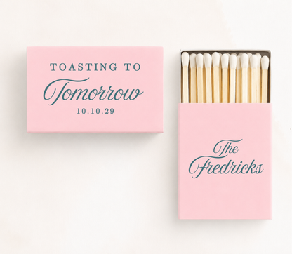 Personalized "Toasting To Tomorrow" wedding matchboxes featuring custom family name and wedding date for rehearsal dinners and wedding weekend celebrations.