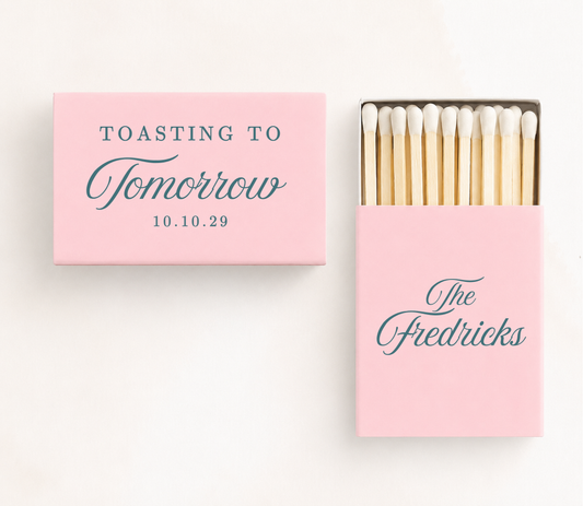 Personalized "Toasting To Tomorrow" wedding matchboxes featuring custom family name and wedding date for rehearsal dinners and wedding weekend celebrations.
