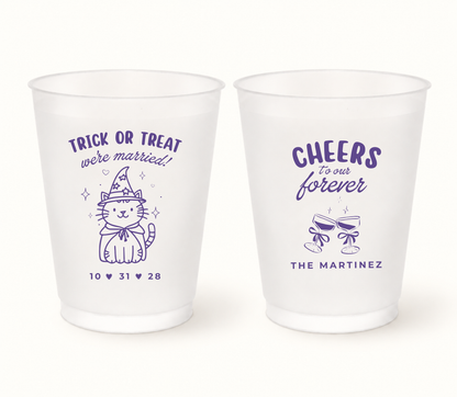 Personalized Trick or Treat We’re Married Halloween wedding frosted cups featuring a purple witch cat design, custom wedding date, family name, and Cheers to Our Forever artwork.