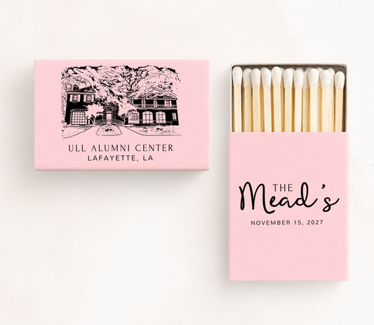 Personalized ULL Alumni Center wedding matchboxes featuring a custom Lafayette, Louisiana venue illustration with family name and wedding date.