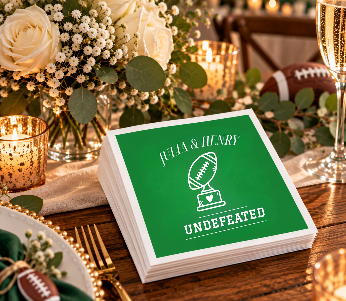Personalized sports wedding napkins with football trophy artwork, heart detail, bold white lettering, and a green background.