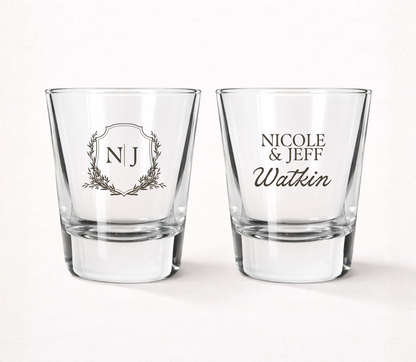Personalized Watkin Monogram wedding shot glasses featuring custom initials, couple names, family name, and elegant botanical monogram crest.