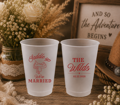 Personalized western wedding frosted cups featuring saddle artwork, custom family name, and wedding date