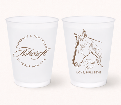 Personalized western wedding frosted cups featuring a custom horse illustration, couple names, family name, and wedding date for rustic ranch wedding celebrations.