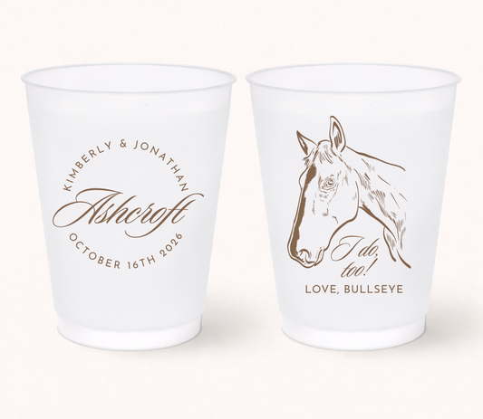 Personalized western wedding frosted cups featuring a custom horse illustration, couple names, family name, and wedding date for rustic ranch wedding celebrations.