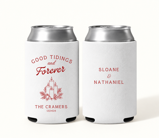 Personalized white Christmas wedding can coolers with red Good Tidings and Forever lettering, candle and greenery artwork, The Cramers surname, wedding date, and Sloane and Nathaniel names.