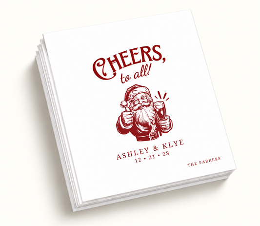 Personalized Cheers To All Christmas wedding napkins featuring vintage Santa illustration, red holiday artwork, custom couple names, and wedding date.