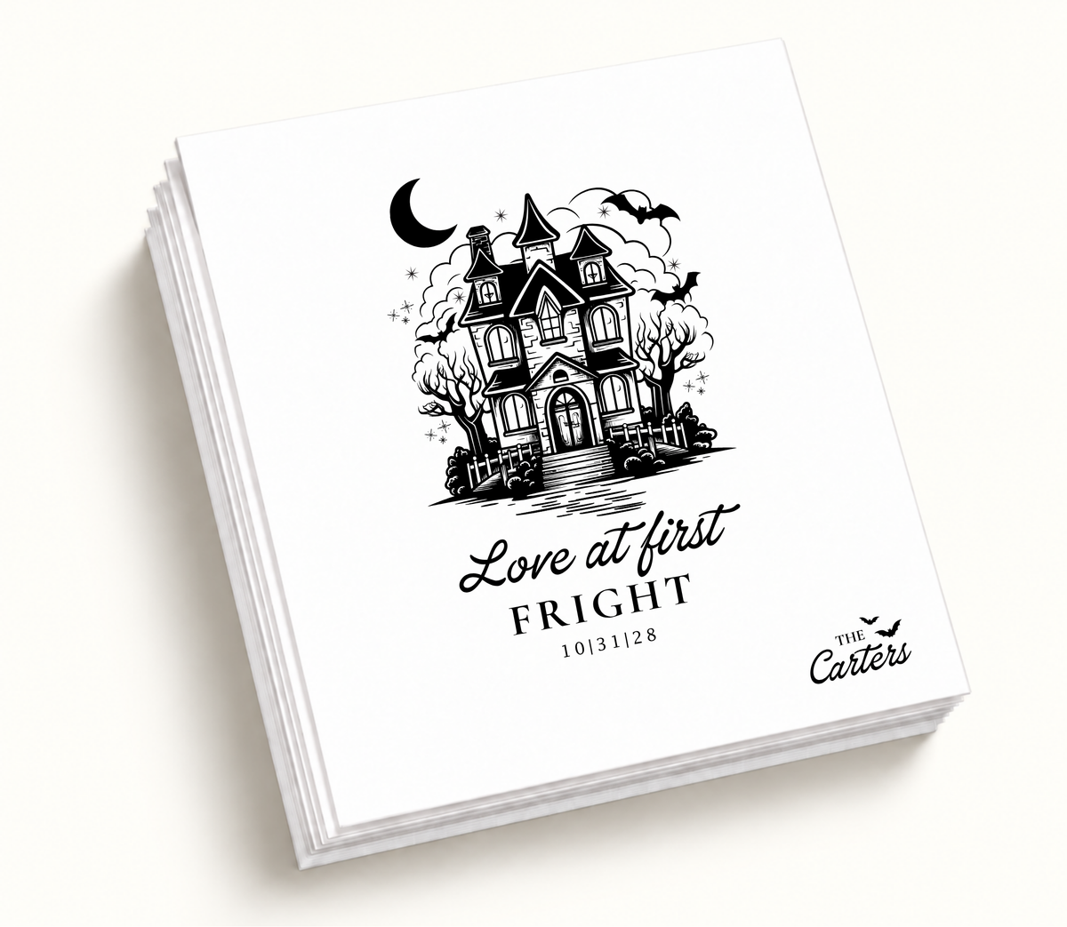 Personalized white Love at First Fright Halloween wedding napkins featuring a black haunted house, crescent moon, bats, wedding date, and The Carters surname.