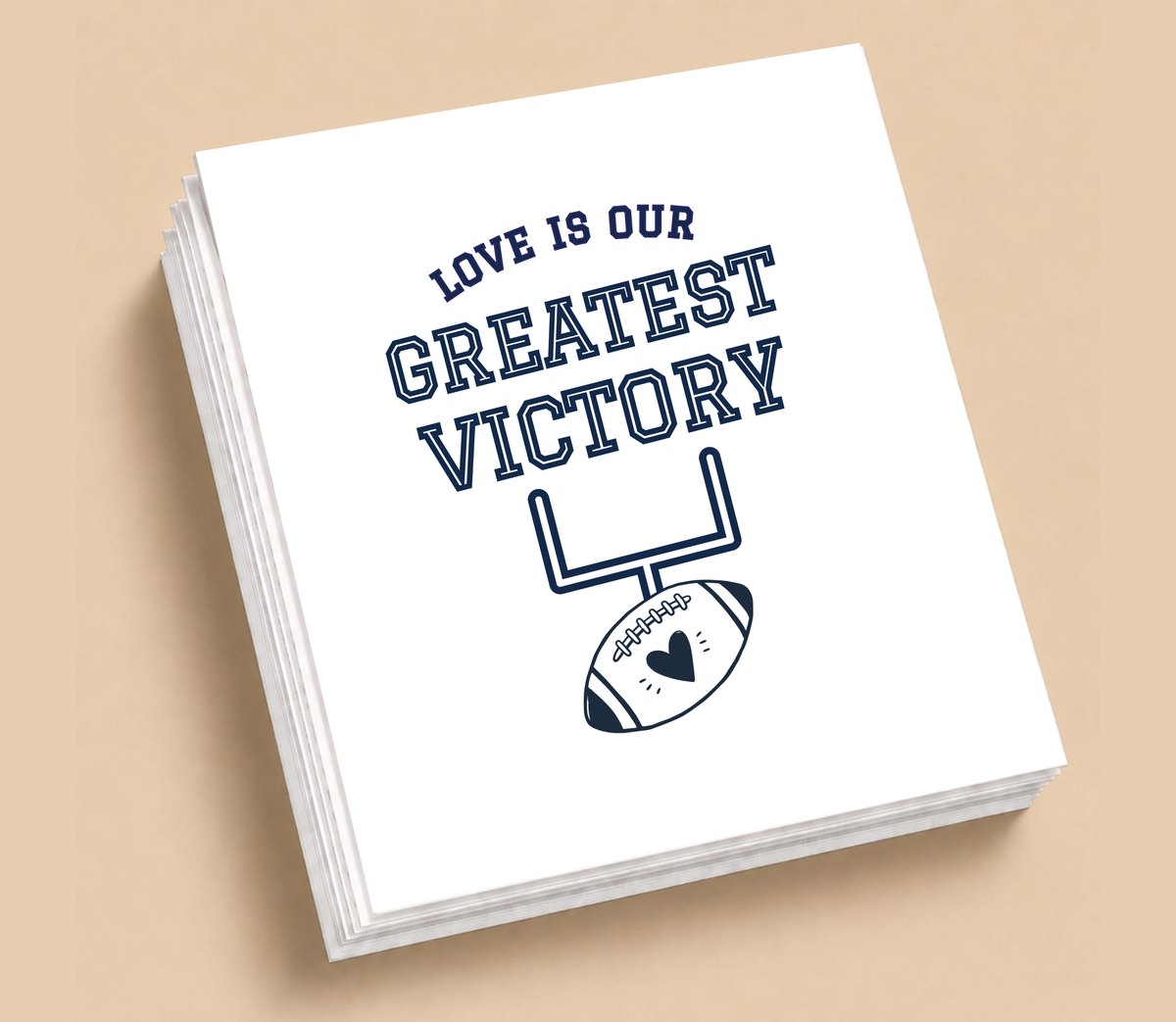 Personalized Love Is Our Greatest Victory football wedding napkins featuring navy blue goalpost and heart artwork on white napkins.