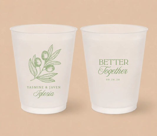 White frosted wedding cups featuring elegant olive branch artwork, custom couple names Yasmine and Javen Iglesia, Better Together design, and wedding date.
