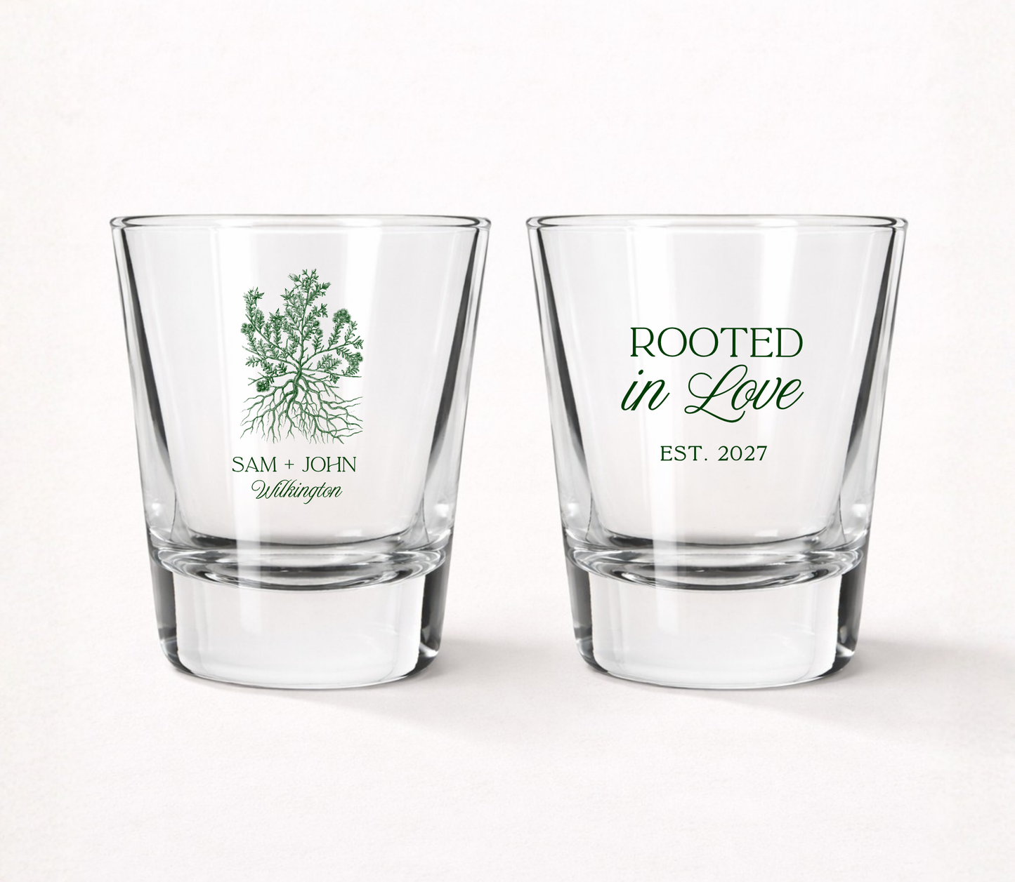 Personalized Rooted in Love wedding shot glasses featuring custom couple names, family name, established year, and a tree with roots illustration.