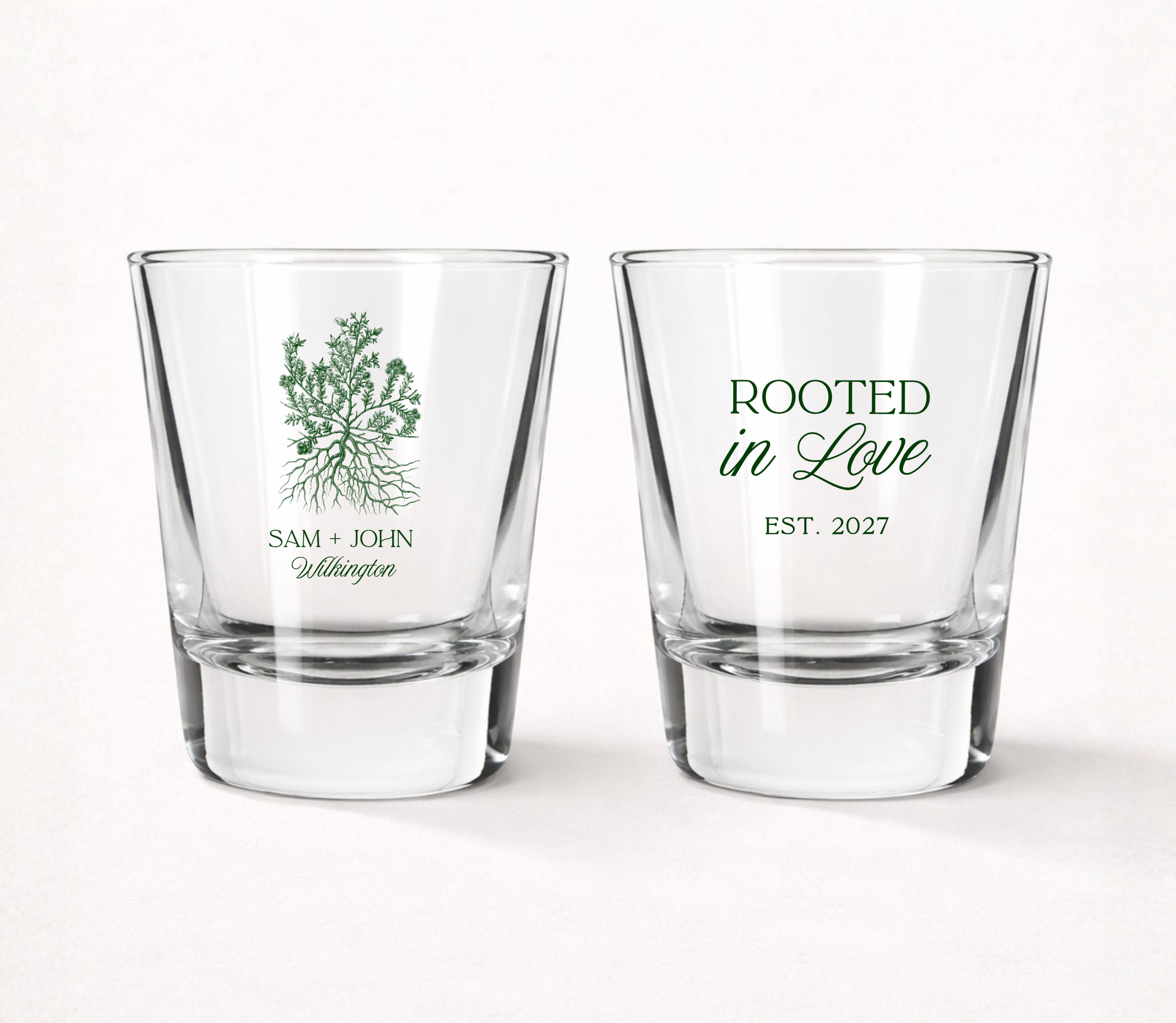 Personalized Rooted in Love wedding shot glasses featuring custom couple names, family name, established year, and a tree with roots illustration.