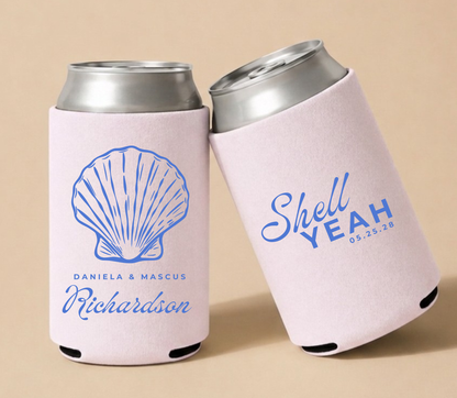 Custom beach wedding can coolers with personalized names, wedding date, and blue seashell artwork on pink drink sleeves

