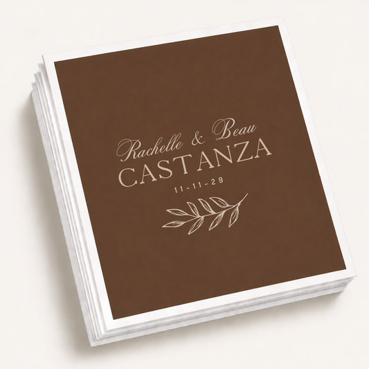 Personalized botanical wedding cocktail napkins featuring custom couple names, family name, wedding date, and a minimalist botanical branch illustration.