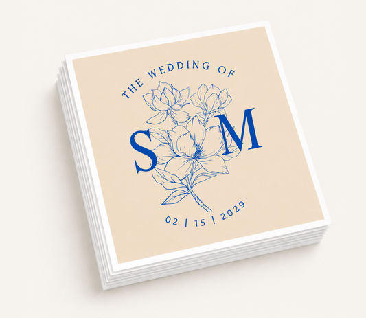 Personalized floral wedding cocktail napkins featuring elegant botanical flowers, oversized custom initials, and wedding date.