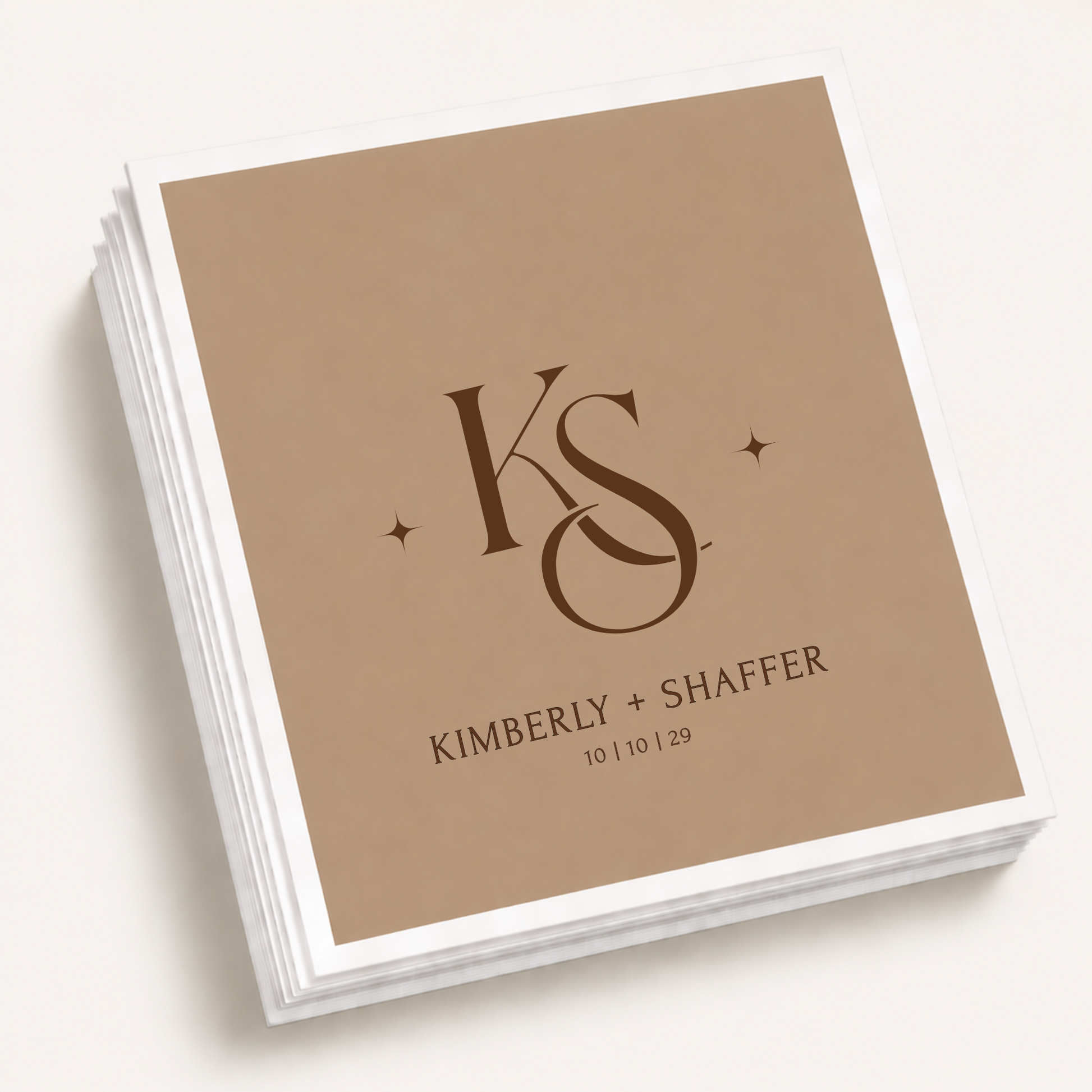 Personalized monogram wedding cocktail napkins featuring custom initials, couple names, and wedding date in an elegant minimalist design.