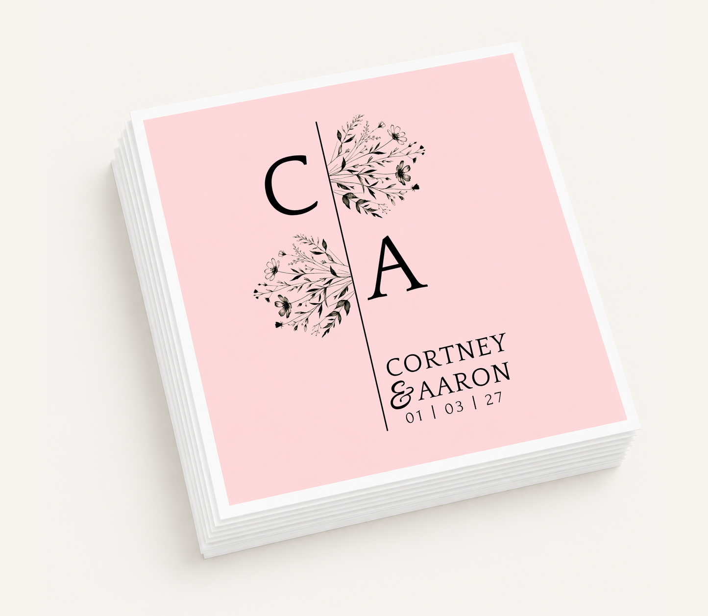 Personalized split monogram wedding cocktail napkins featuring floral botanical accents, custom initials, couple's names, and wedding date.