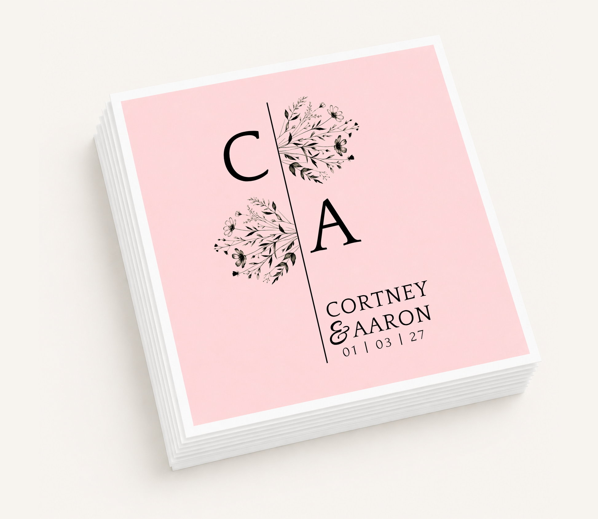 Personalized split monogram wedding cocktail napkins featuring floral botanical accents, custom initials, couple's names, and wedding date.