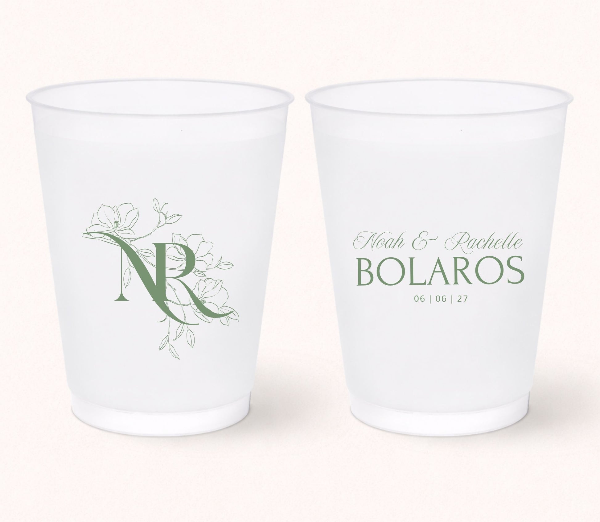 Two personalized frosted wedding cups featuring a floral monogram "NR" on one side and Noah & Rachelle Bolaros with the wedding date 06.06.27 printed in elegant sage green on the reverse.
Personalized wedding frosted cup featuring a floral monogram initial and elegant botanical artwork.
Custom monogram wedding drink cup with personalized couple names and wedding date.