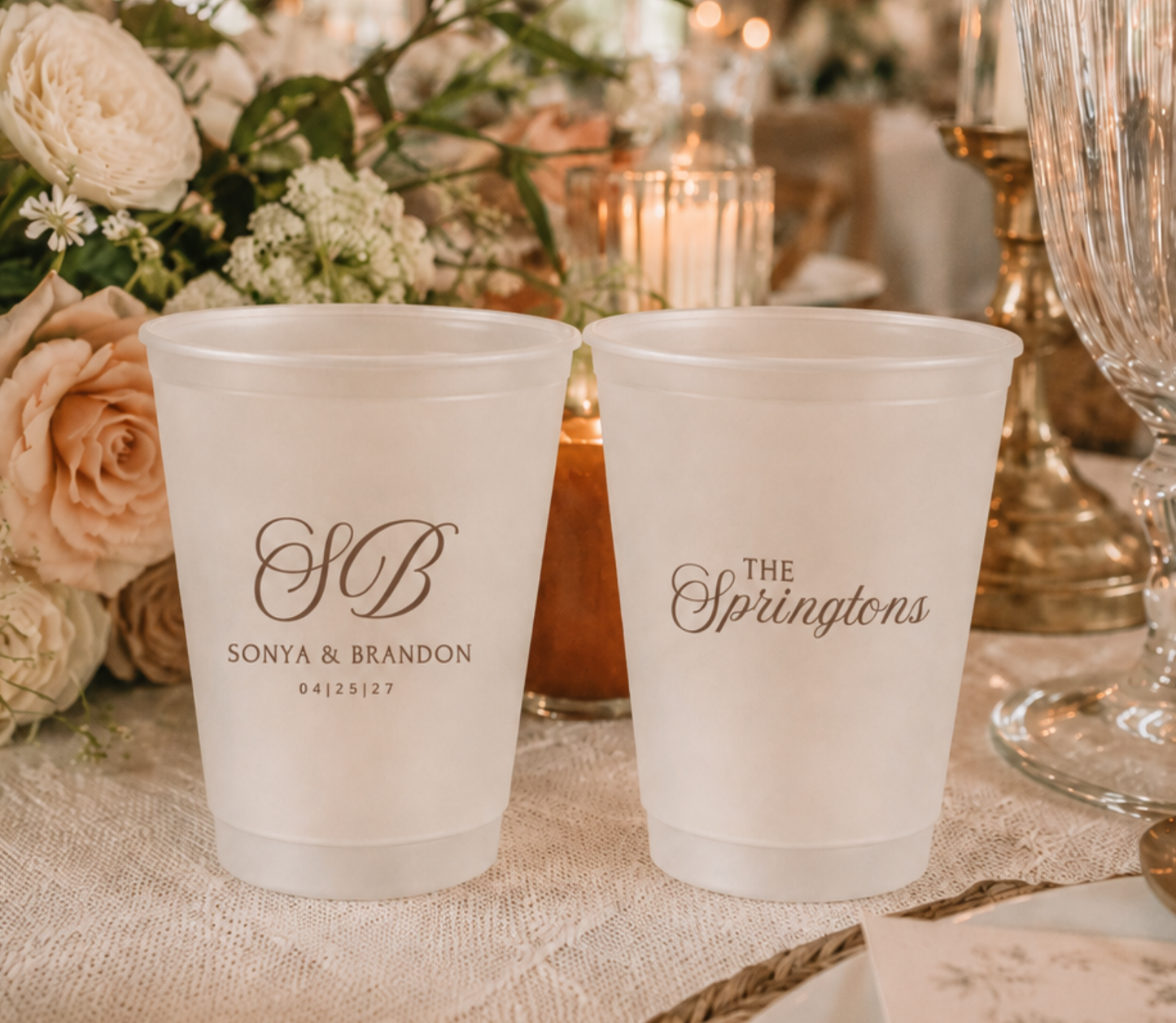 Custom signature frosted wedding cups with personalized initials, couple names, and wedding date for reception bars