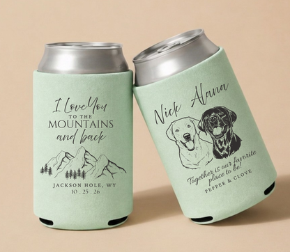 Forest green personalized wedding can coolers featuring scenic mountain artwork, custom dog portraits, couple names, wedding location, and wedding date.