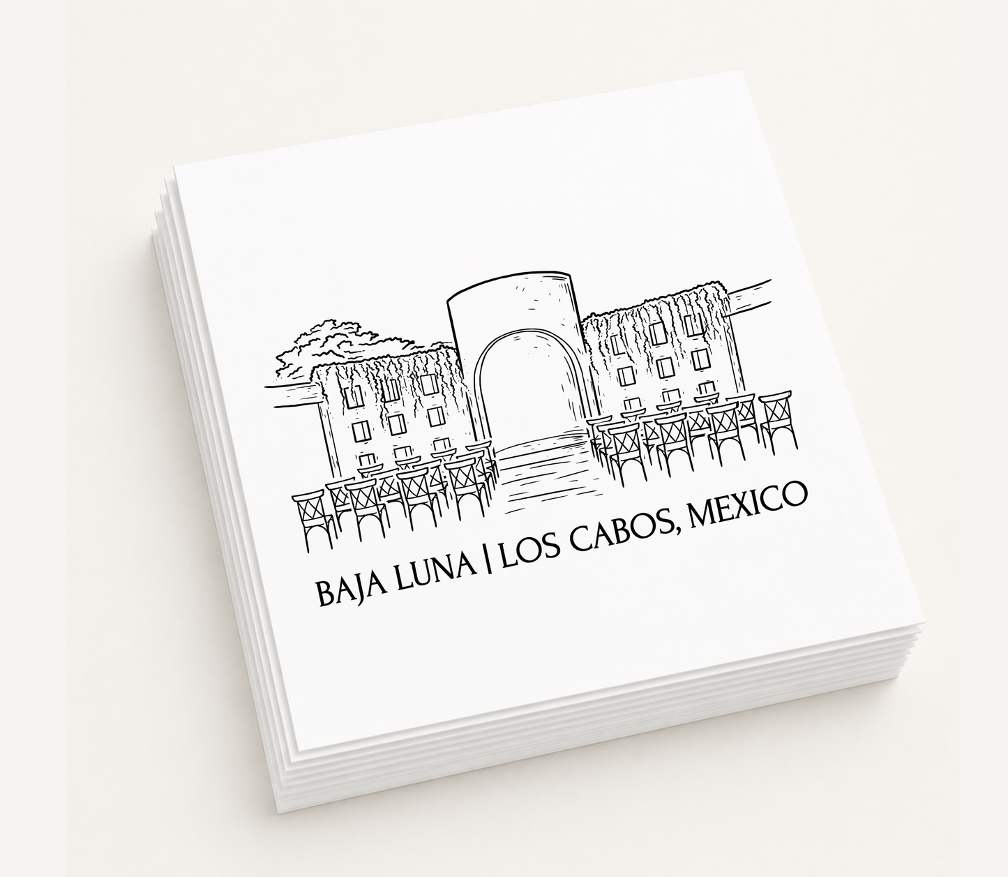 Personalized white cocktail napkins featuring a hand-drawn illustration of Baja Luna in Los Cabos, Mexico.