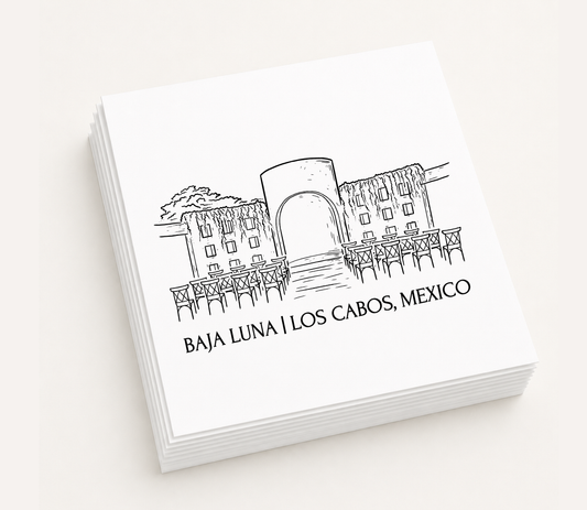 Personalized white cocktail napkins featuring a hand-drawn illustration of Baja Luna in Los Cabos, Mexico.