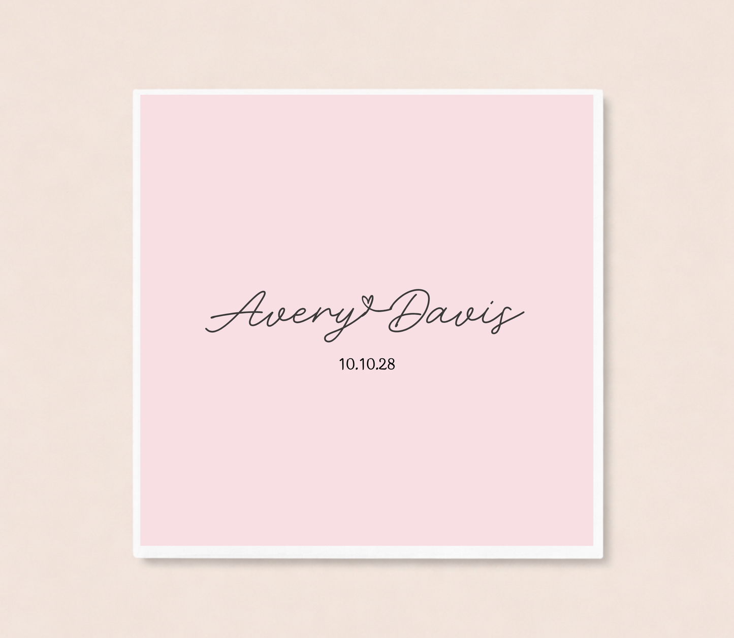 Personalized minimalist cocktail napkins featuring handwritten couple names connected by a heart and custom wedding date.