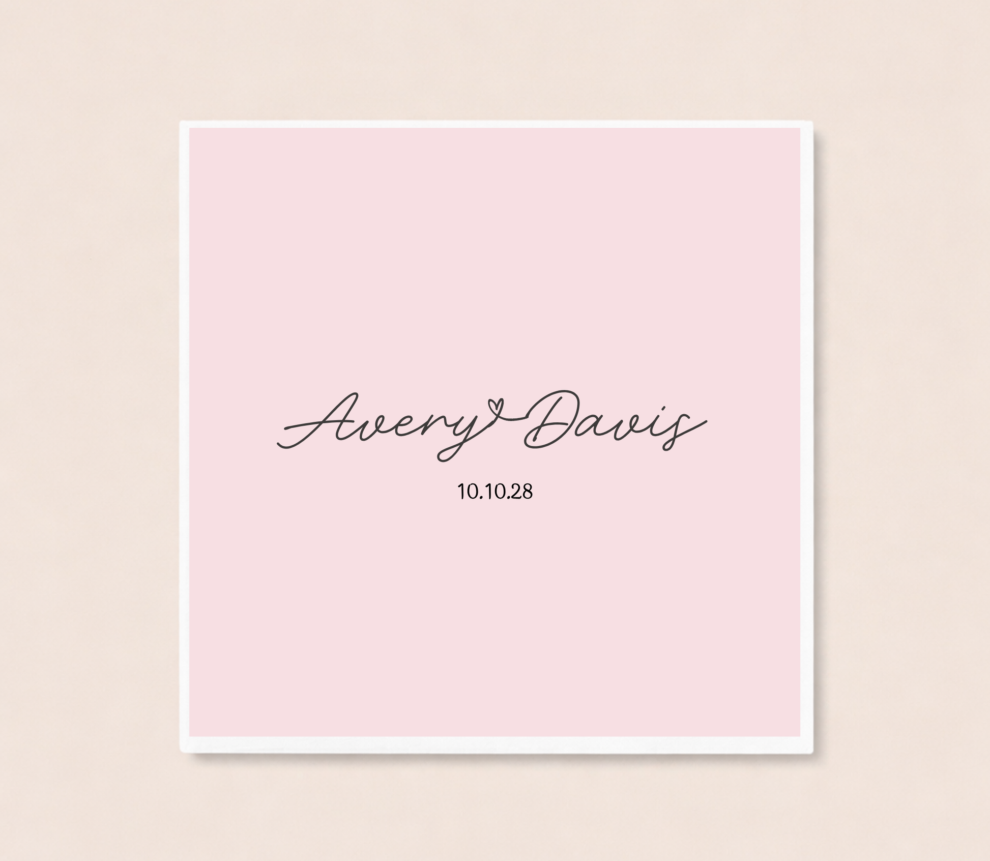 Personalized minimalist cocktail napkins featuring handwritten couple names connected by a heart and custom wedding date.