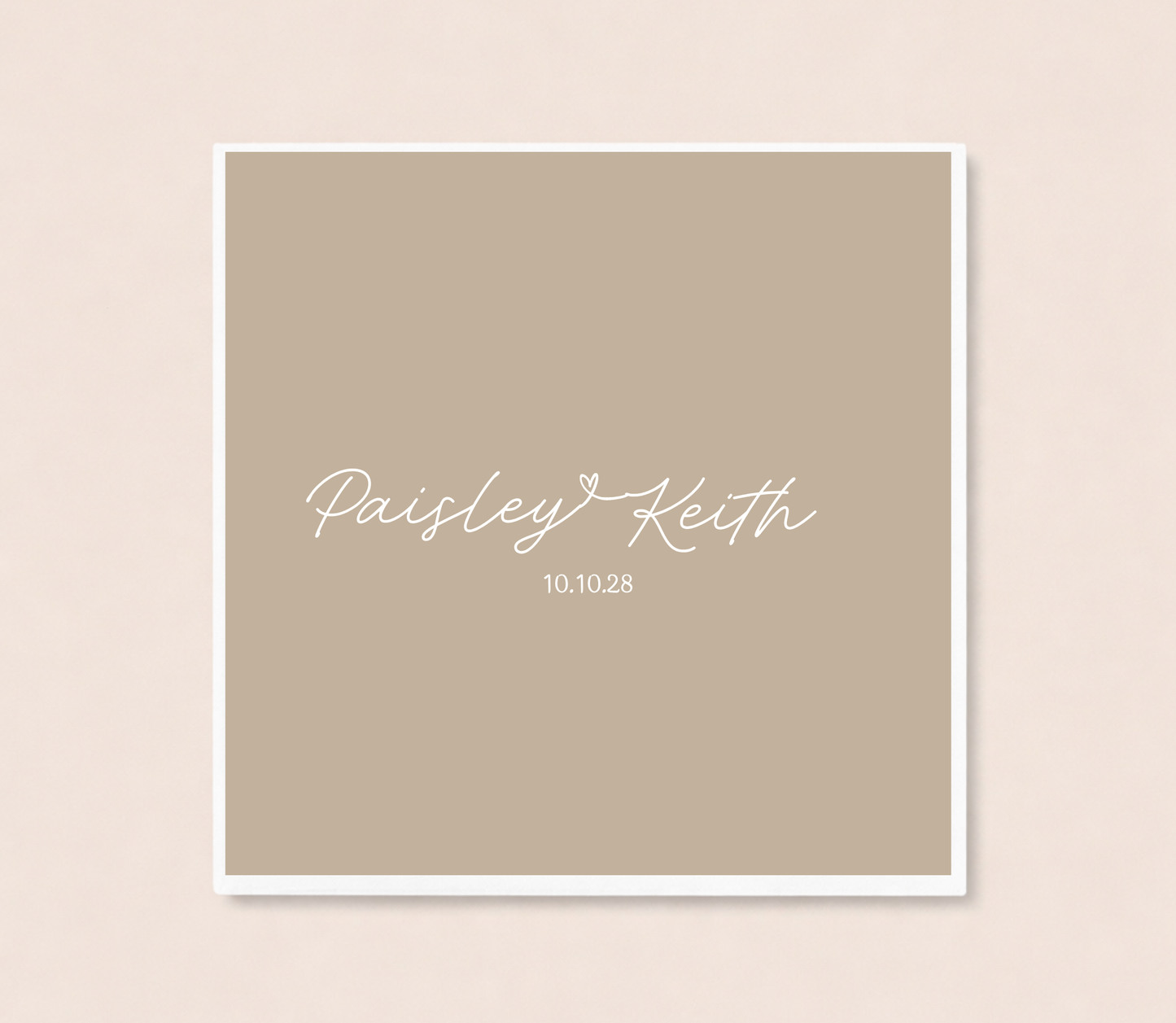 Personalized minimalist wedding cocktail napkins featuring handwritten couple names connected by a heart and custom wedding date.