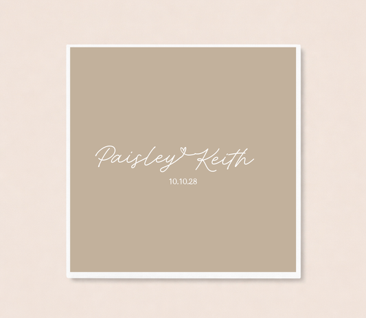 Personalized minimalist wedding cocktail napkins featuring handwritten couple names connected by a heart and custom wedding date.