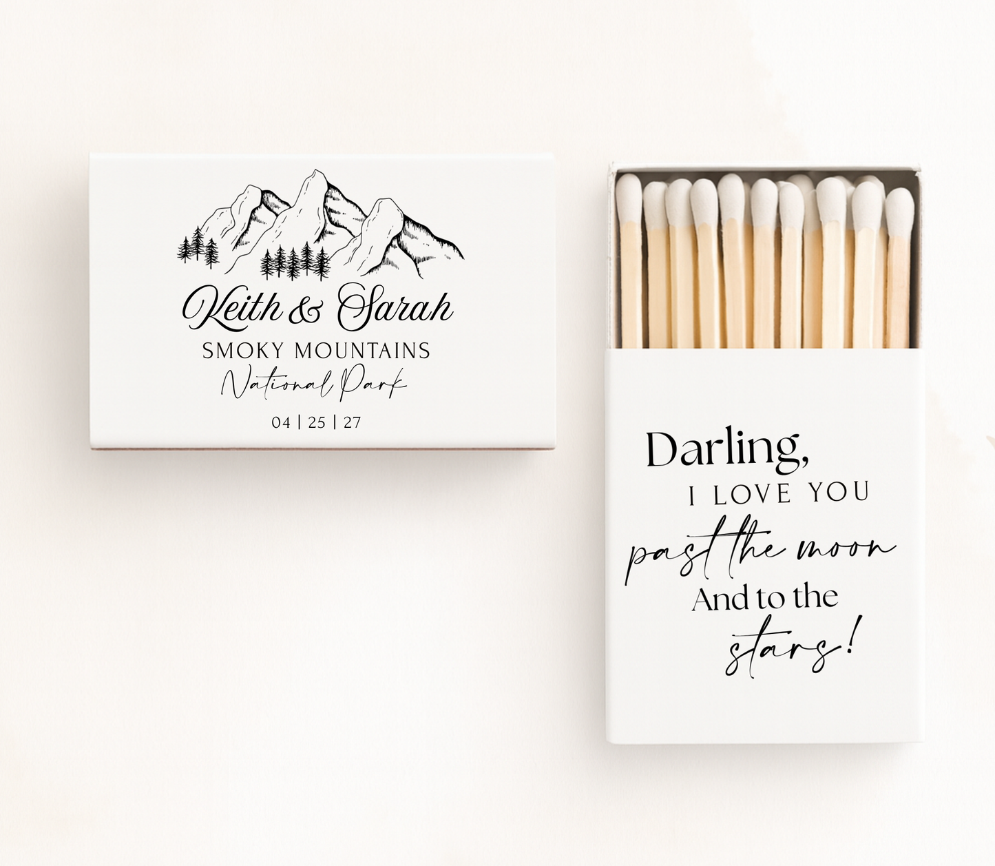 Personalized mountain wedding matchboxes featuring custom couple names, national park location, wedding date, mountain illustration, and romantic quote.