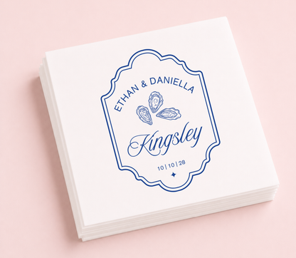 Personalized oyster wedding cocktail napkins featuring custom names, family name, wedding date, and elegant oyster illustration.