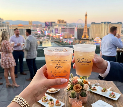 Custom Las Vegas wedding frosted cups with personalized names, destination inspired skyline artwork, and wedding details