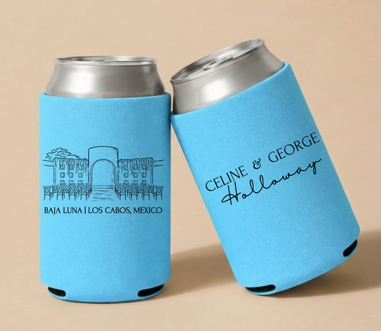 Sky blue personalized wedding can coolers featuring a Baja Luna Los Cabos venue illustration with custom couple names for a destination wedding.