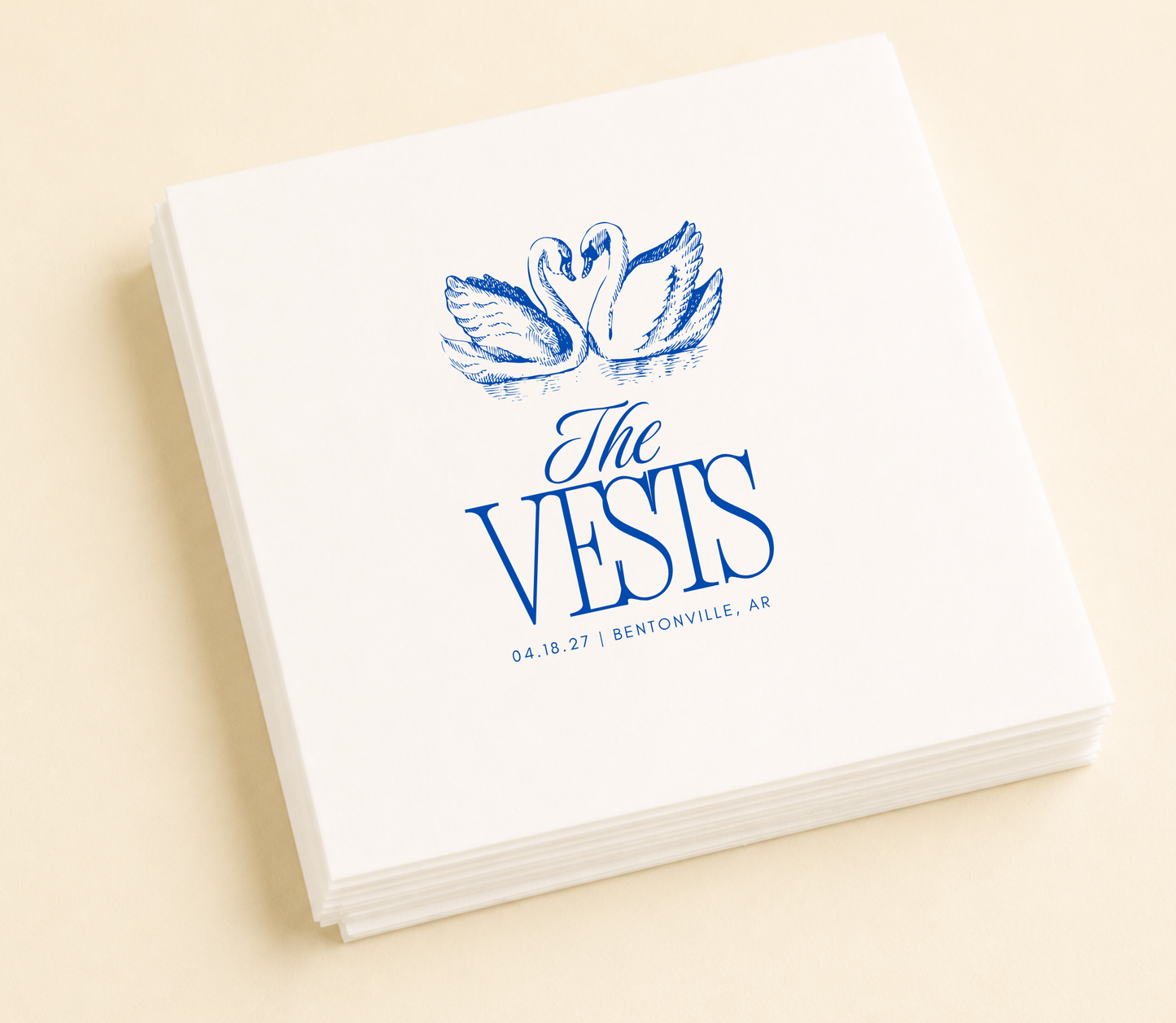 Personalized swan wedding cocktail napkins featuring a romantic swan illustration, custom family name, wedding date, and wedding location.