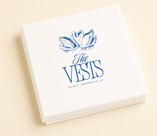 Personalized swan wedding cocktail napkins featuring a romantic swan illustration, custom family name, wedding date, and wedding location.