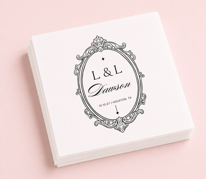 Personalized vintage monogram wedding cocktail napkins featuring an ornate antique frame, custom initials, family name, wedding date, and wedding location.