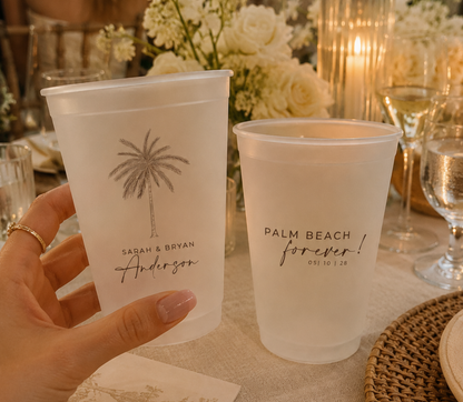 Personalized tropical wedding cups with palm tree artwork on frosted plastic cups for beach receptions and signature cocktails